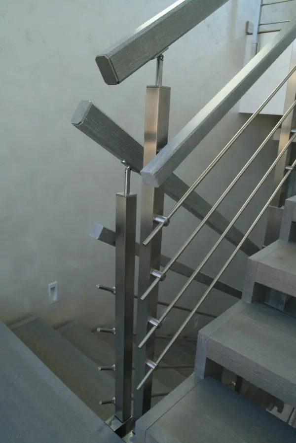 Modern metal stair covered by patina oak