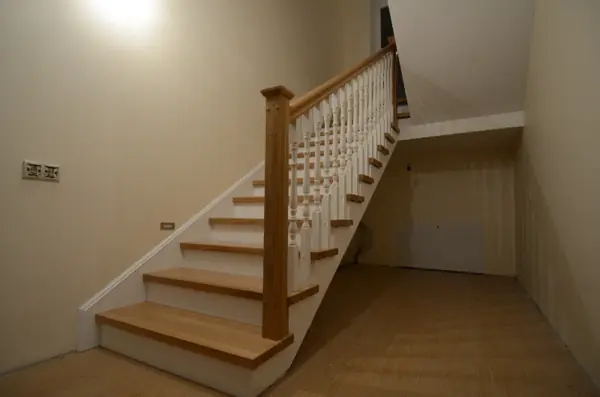 Wood cladding of a concrete stair
