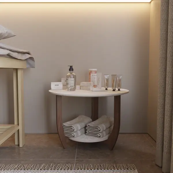 Журнальный столик ДОМОВОЙ белого цвета в массажной студии