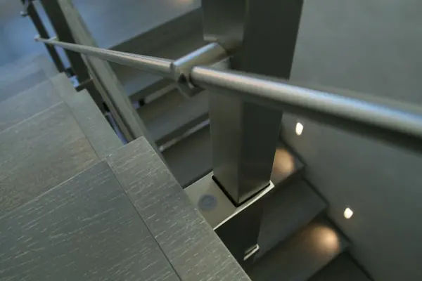 Modern metal stair covered by patina oak