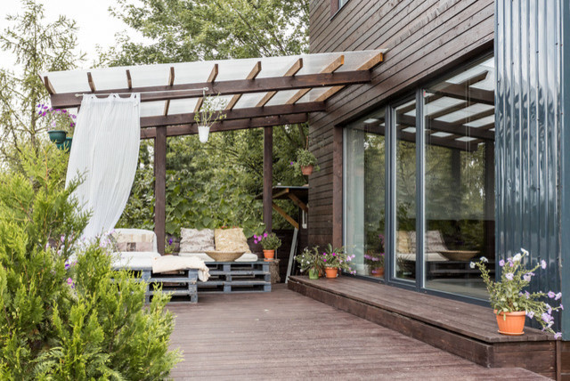 Houzz-тур: Дом с панорамными окнами и бетонным потолком