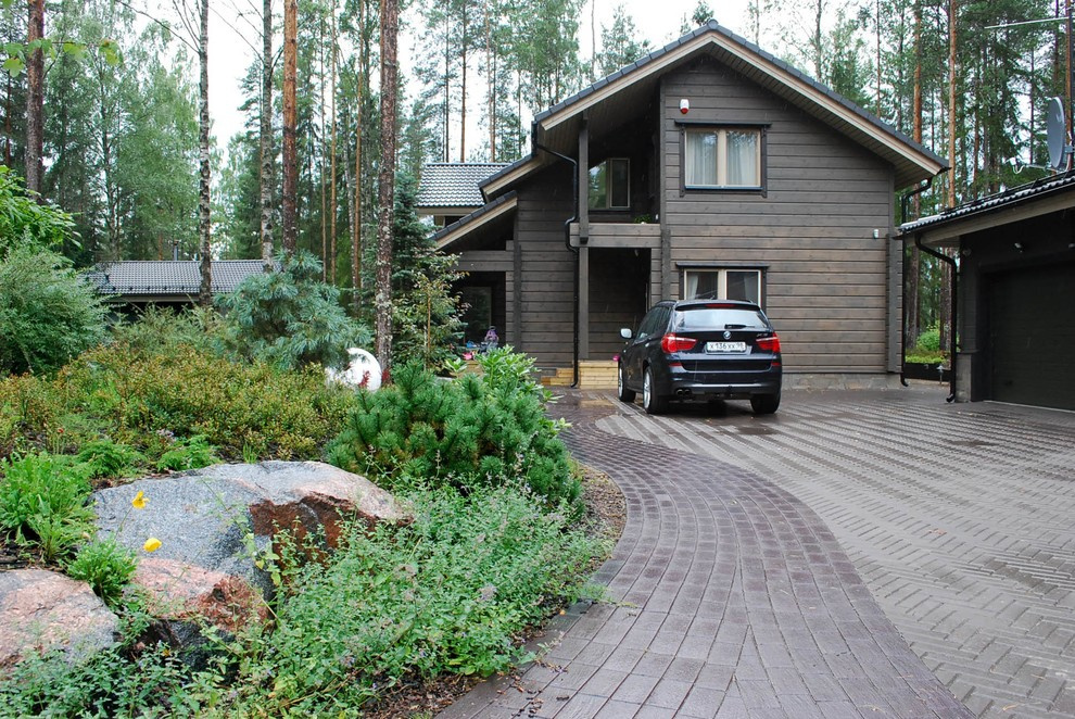 Дачные пропилеи: Выбираем ворота и покрытие для парковки на даче