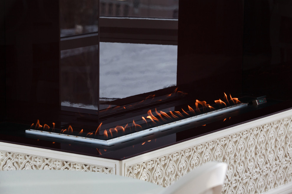 Гостиная с камином, угловой автоматический биокамин Decoflame