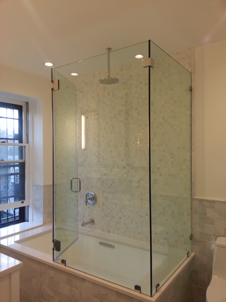 Frameless shower enclosures