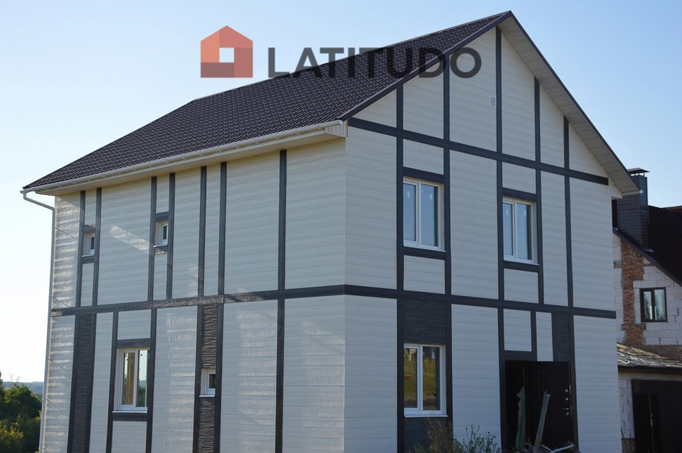 Обшивка фасада фиброцементным сайдингом Cedral и панелями KMEW