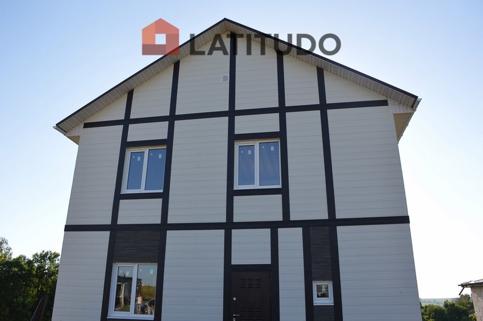 Обложка проекта: Обшивка фасада фиброцементным сайдингом Cedral и панелями KMEW