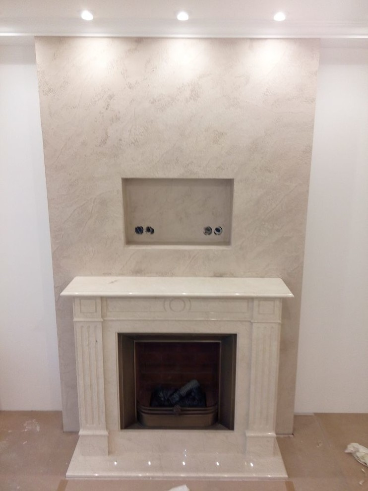 Оформление камина декоративной штукатуркой