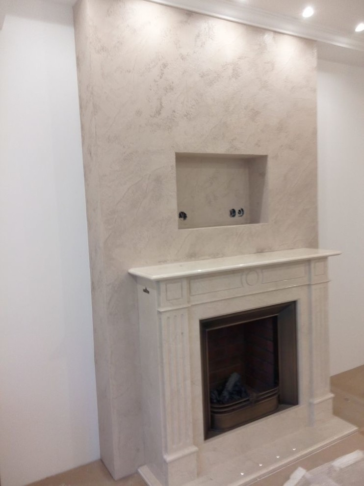 Оформление камина декоративной штукатуркой