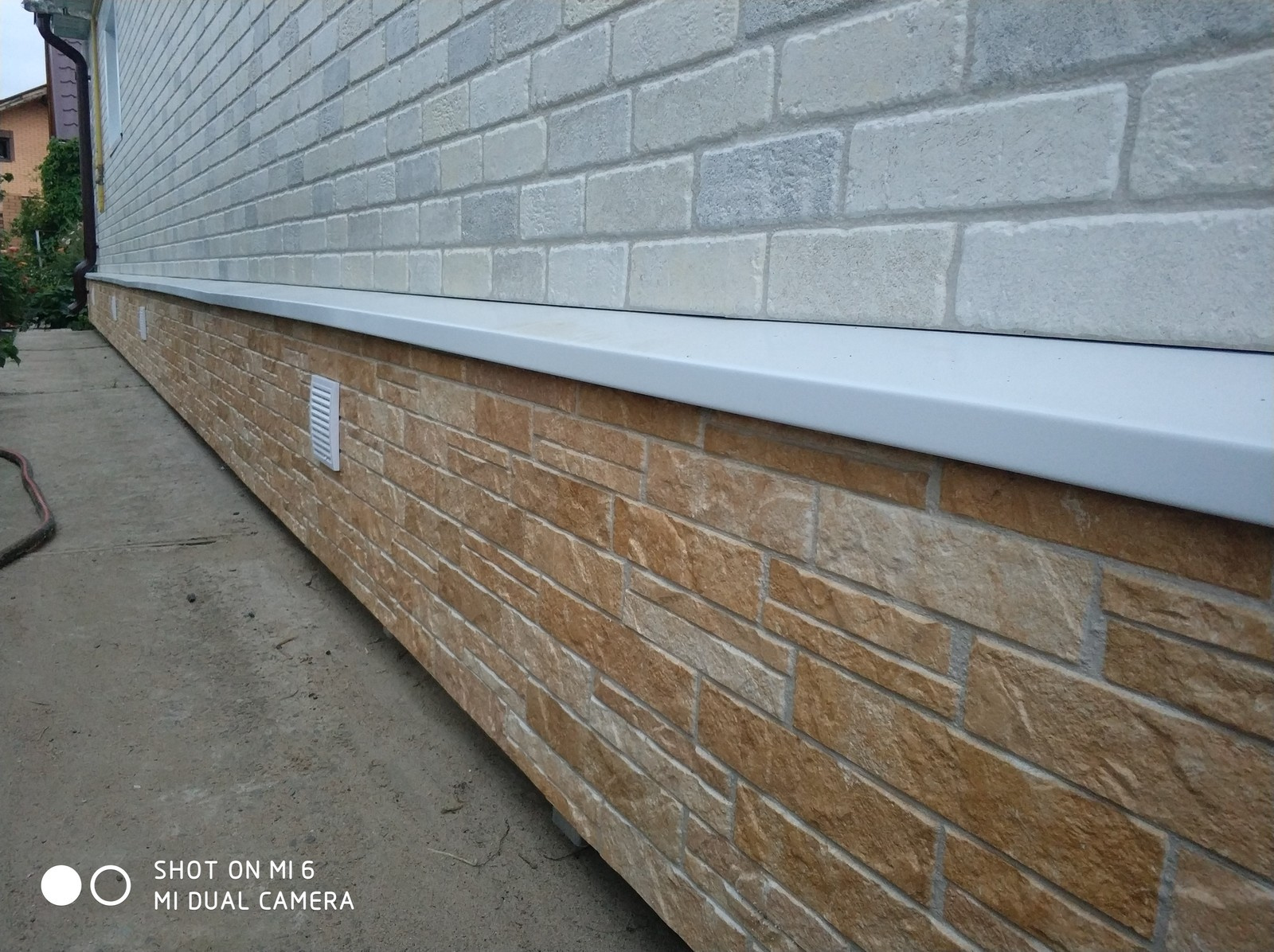 Облицовка фасада японскими фиброцементными панелями Nichiha