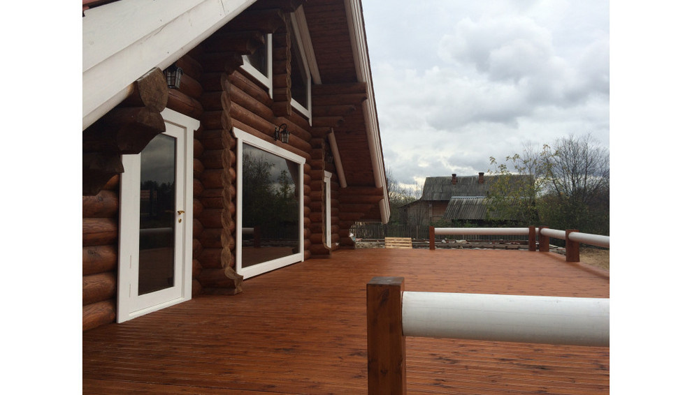 Дом в стиле шале из оцилиндрованного бревна 280 мм