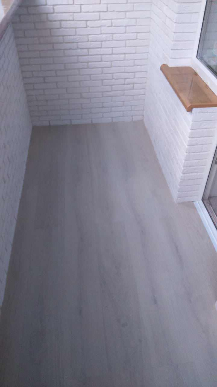 Замена остекления, утепление и отделка балкона декоративным камнем