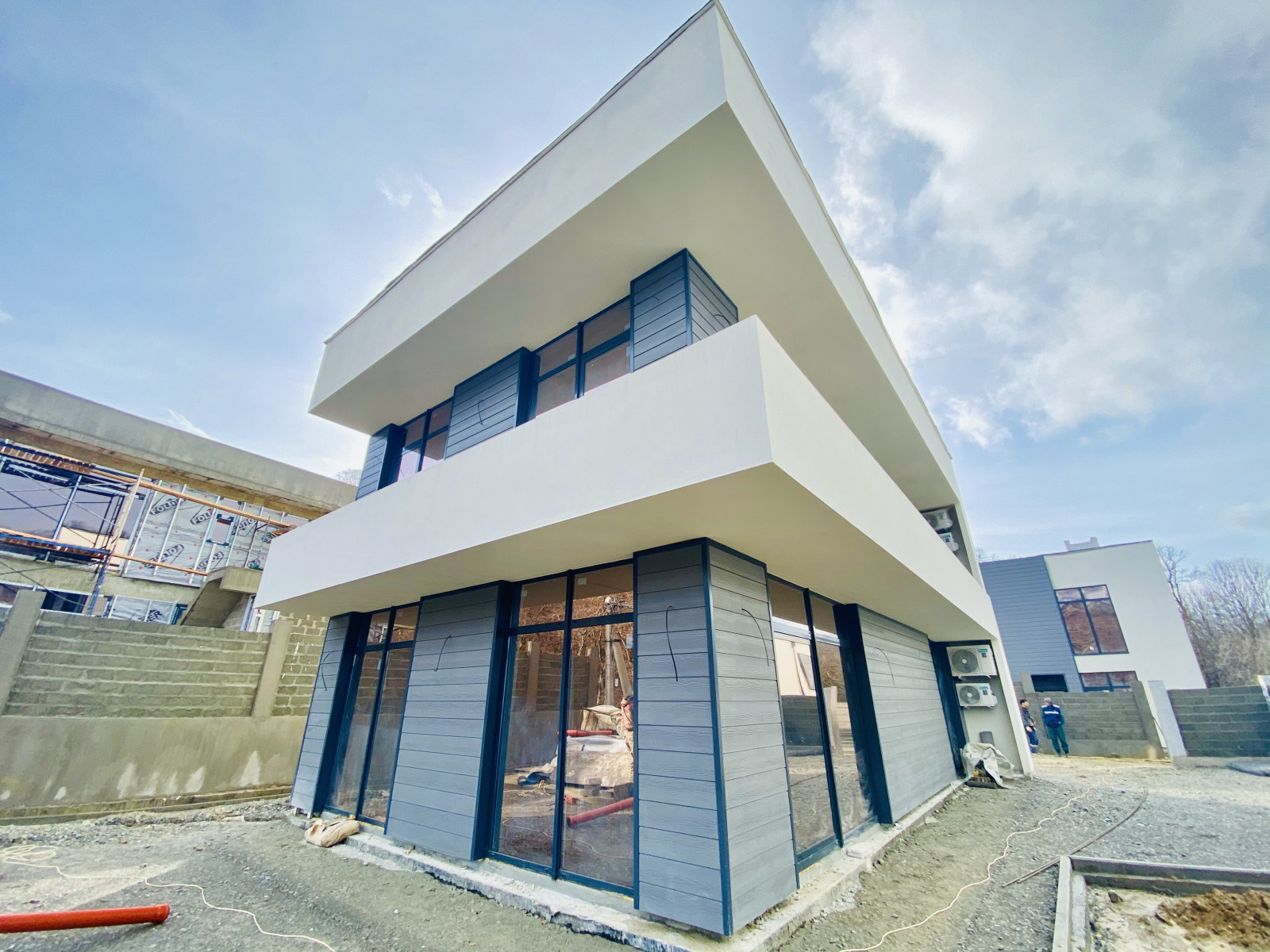 Отделка фасадов коттеджного поселка