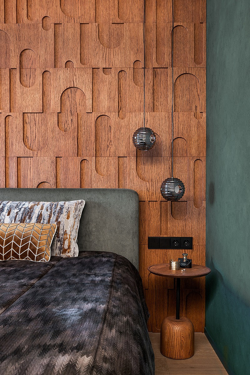 Современный интерьер с зелёными акцентами и паркетом Coswick