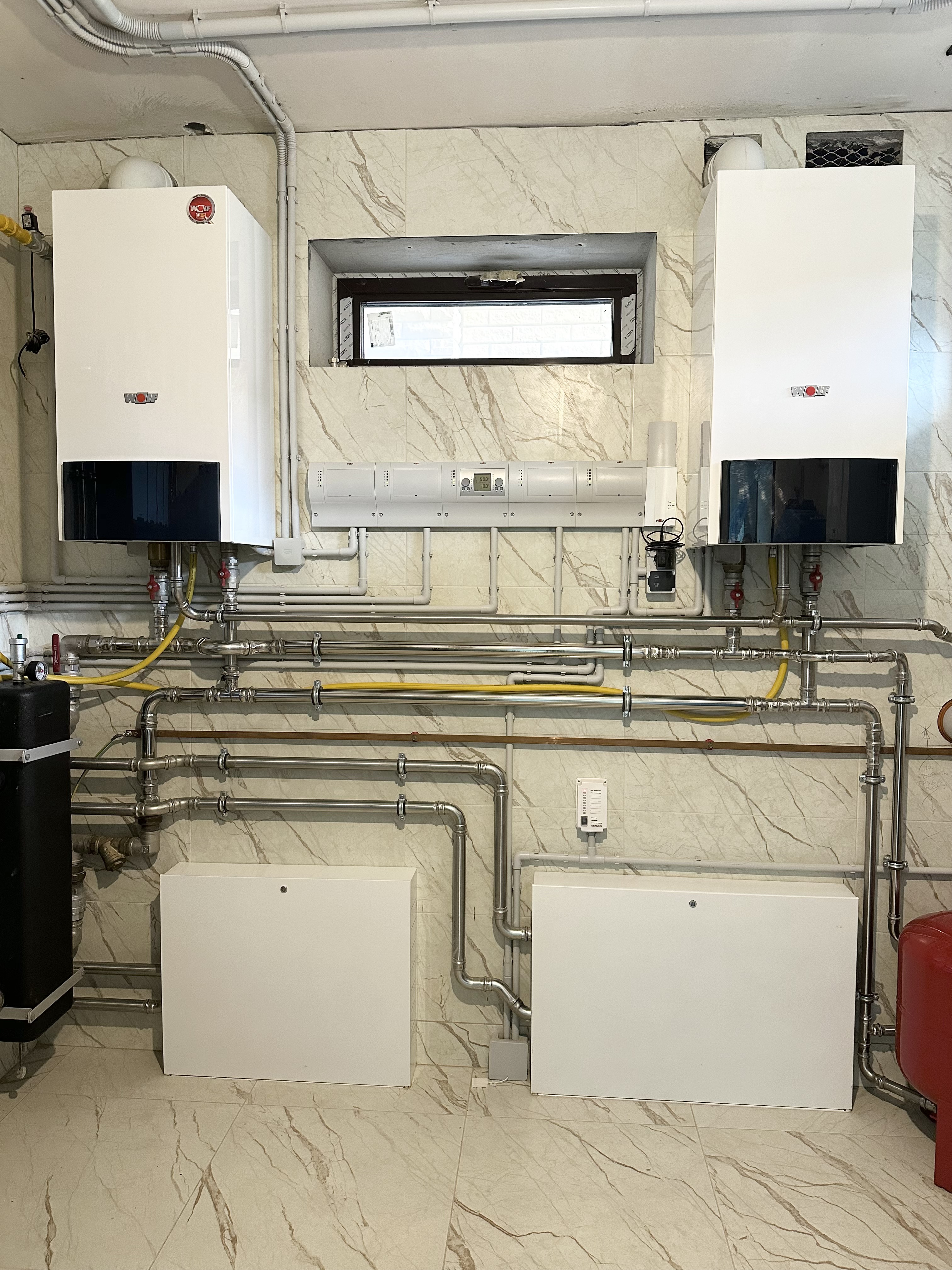 Котельная в доме 400 м2 на базе двух котлов Wolf с погодозависимой автоматизацией