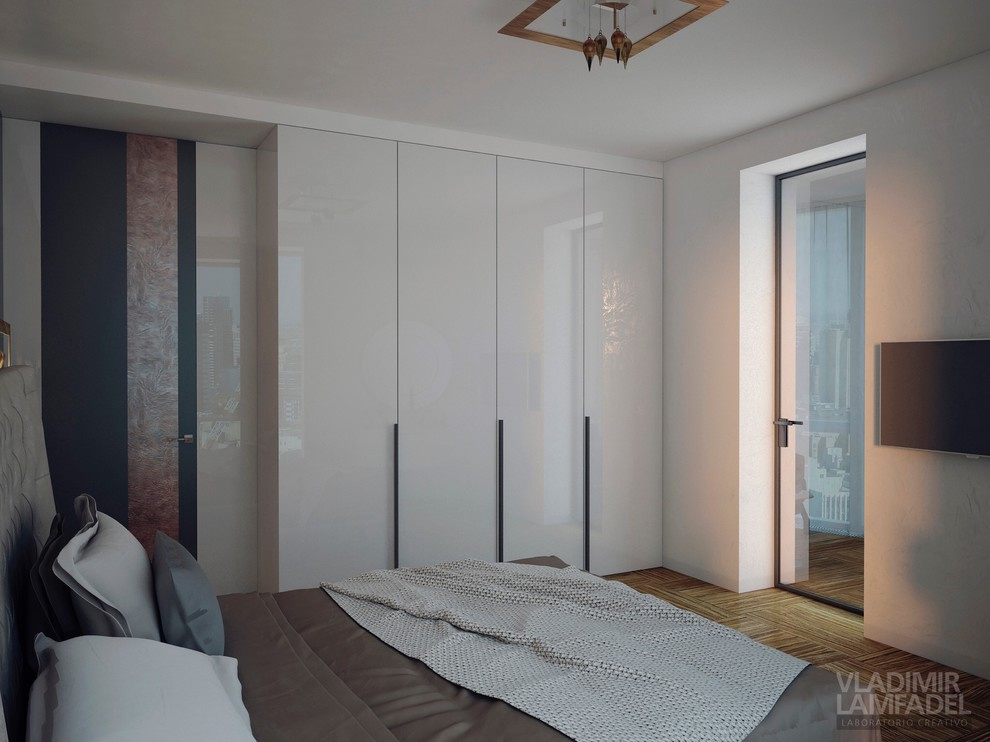 Una piccola camera da letto con balcone.