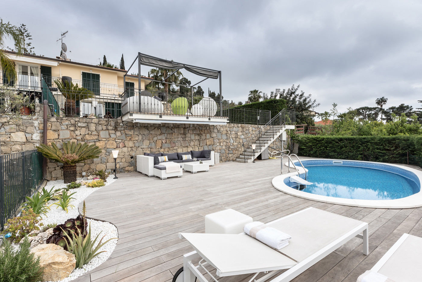 Lounge zone near a modern pool. Villa on Cote d'Azur.