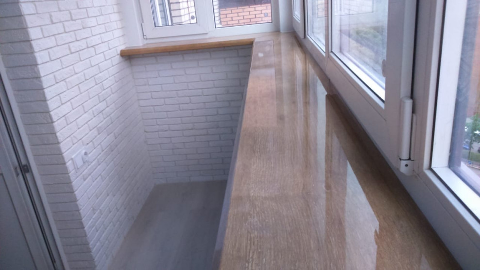 Замена остекления, утепление и отделка балкона декоративным камнем