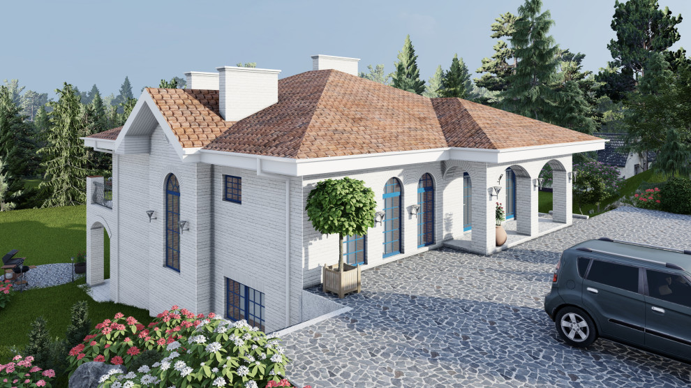 Дом в средиземноморском стиле на участке с уклоном.