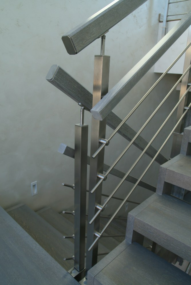Modern metal stair covered by patina oak