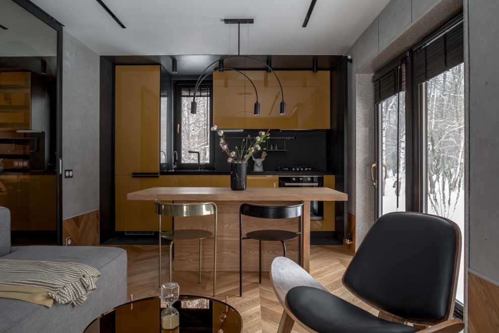 Глянцевая кухня с бетонной стеной