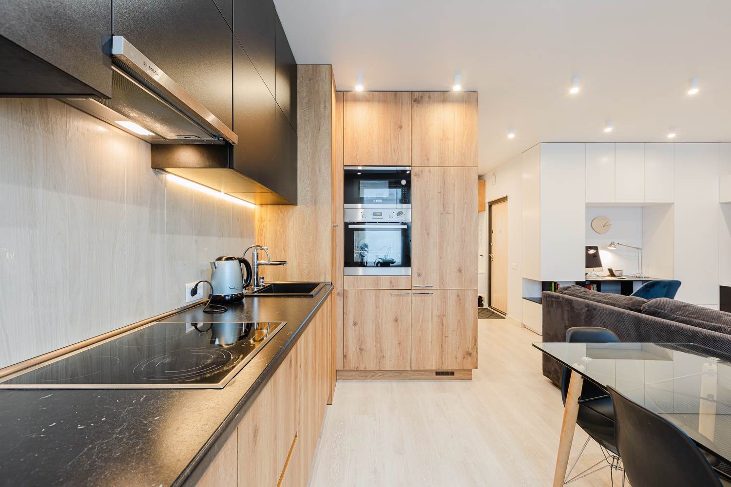 Modern flat-fronted kitchen with dining area