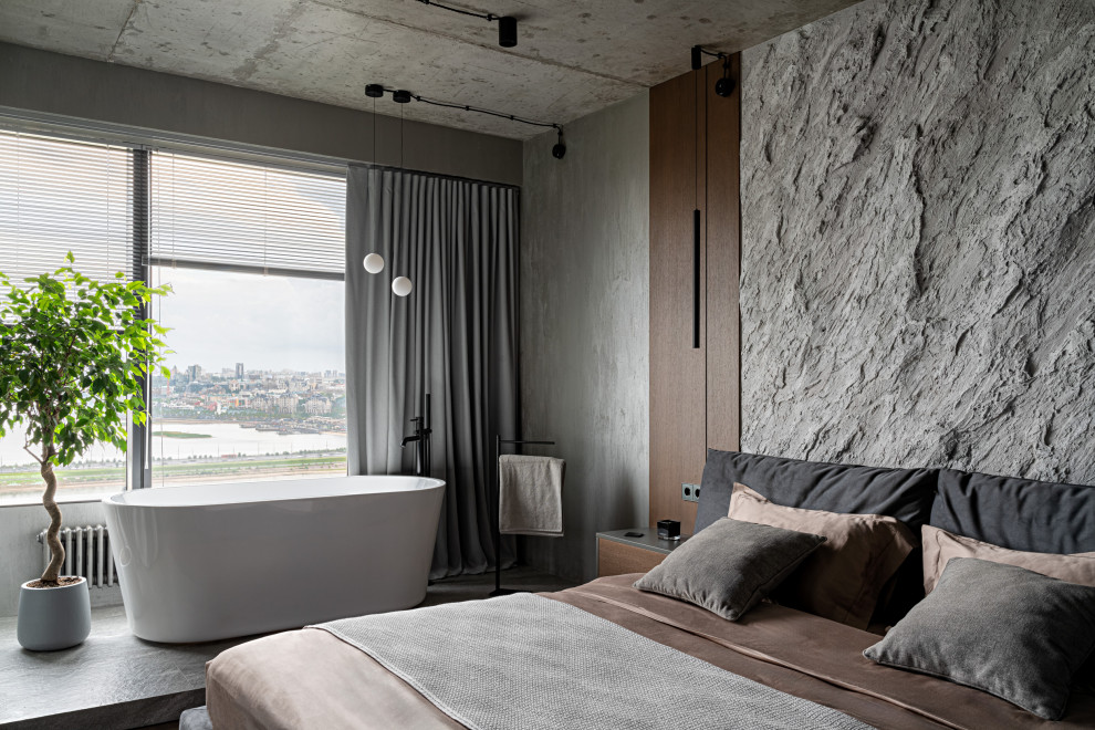 Бетонная квартира с ванной у окна