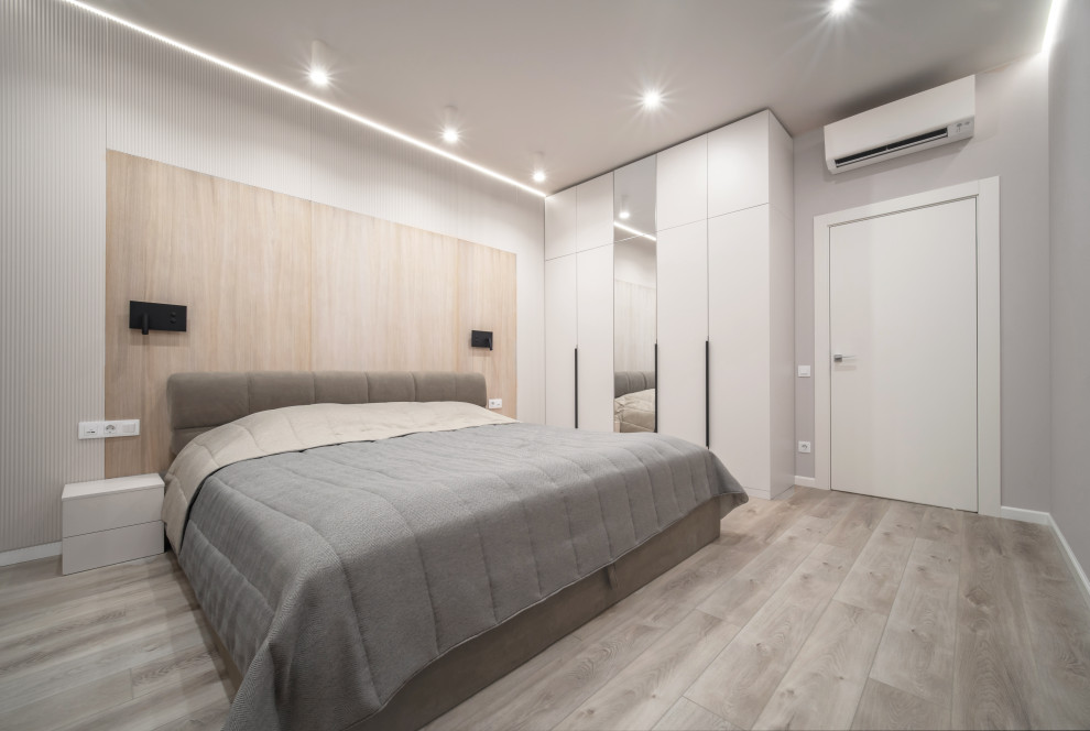 Spacious bedroom with contemporary wood paneling, London