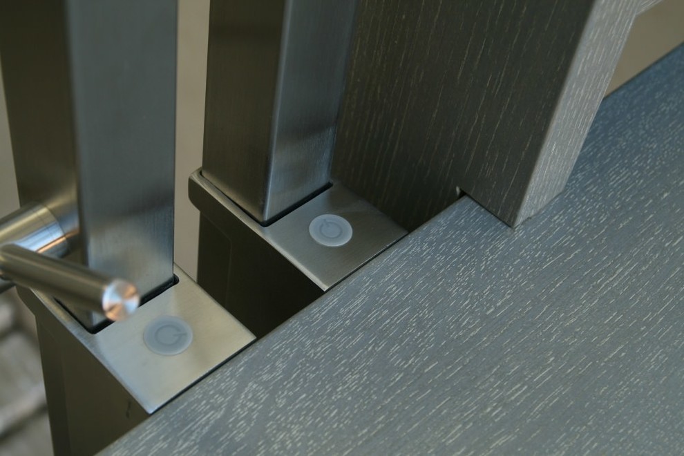 Modern metal stair covered by patina oak