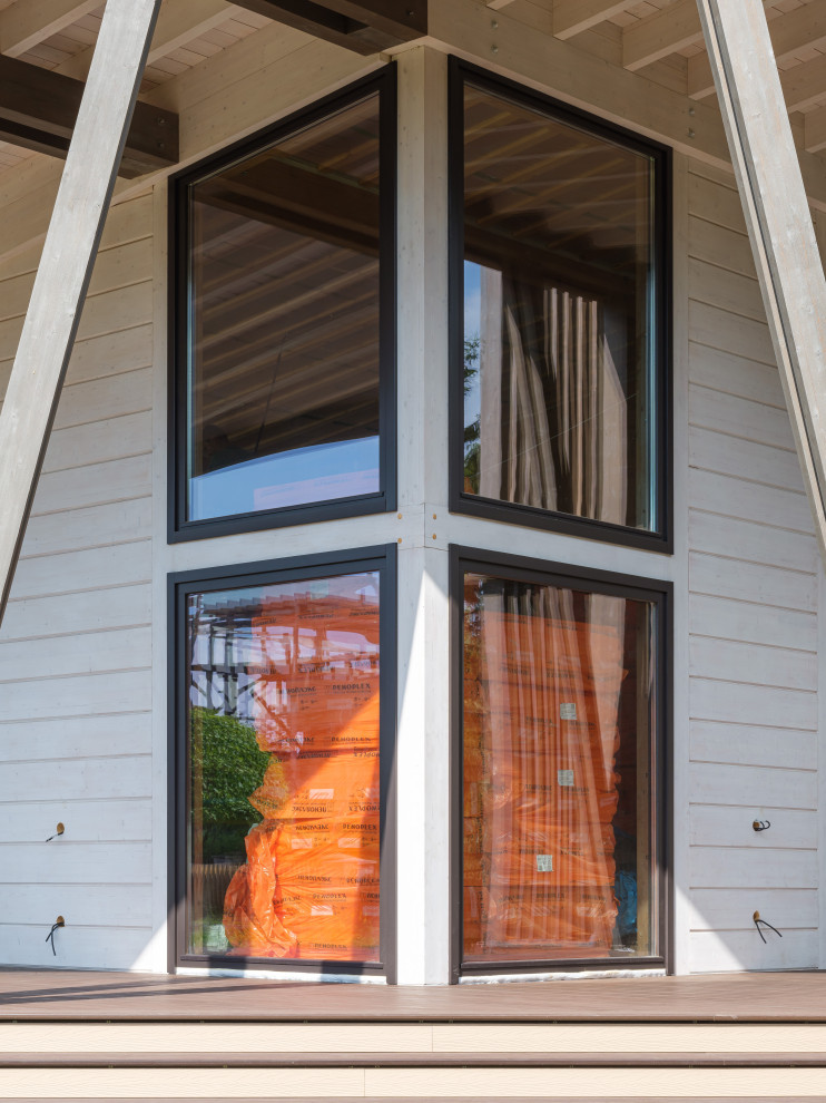 Трапецевидные окна, порталы и входные двери для современного дома