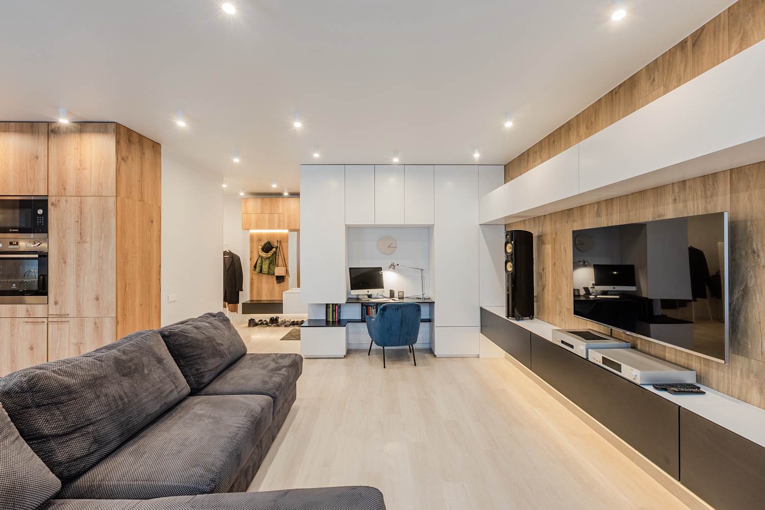 Living room with a workplace in a modern style, a single space