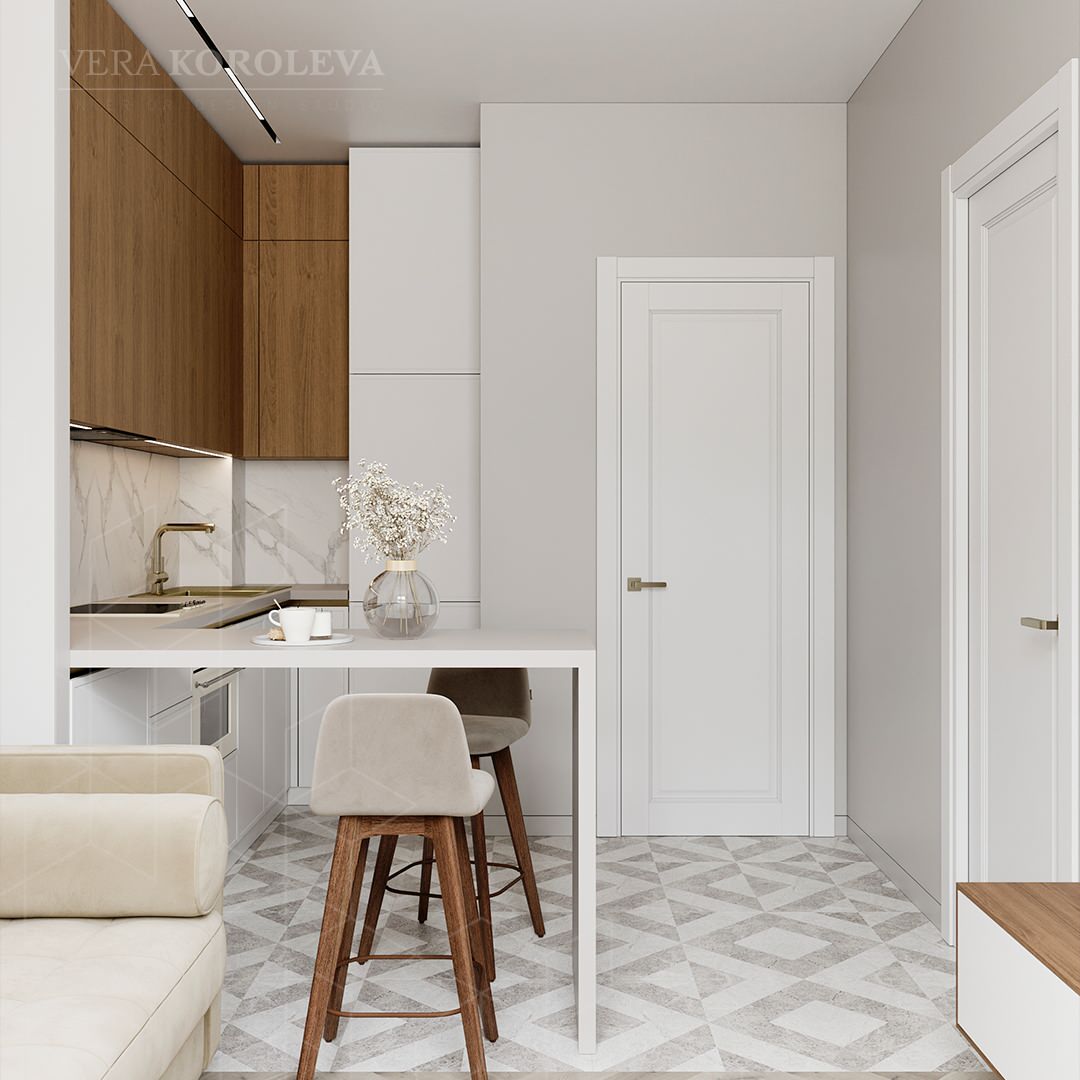 Кухня-гостиная с барной стойкой и диваном в небольшой квартире для молодой пары