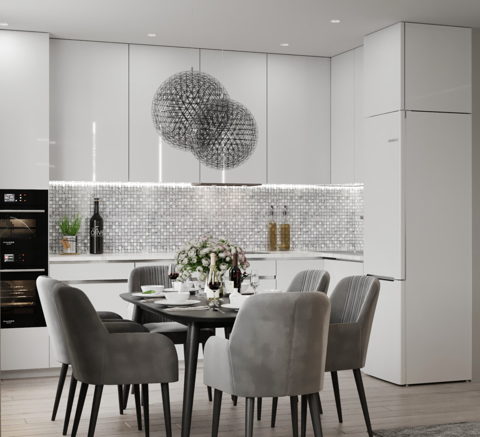 Белая глянцевая кухня и столовая зона