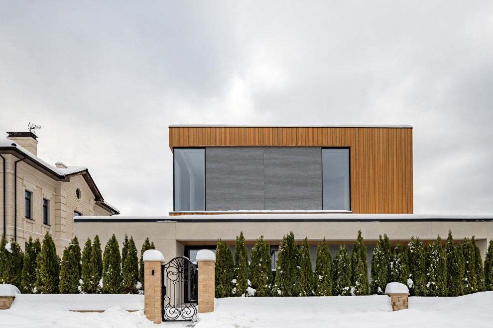 Двухэтажный загородный дом в современном стиле с глиняными акцентами