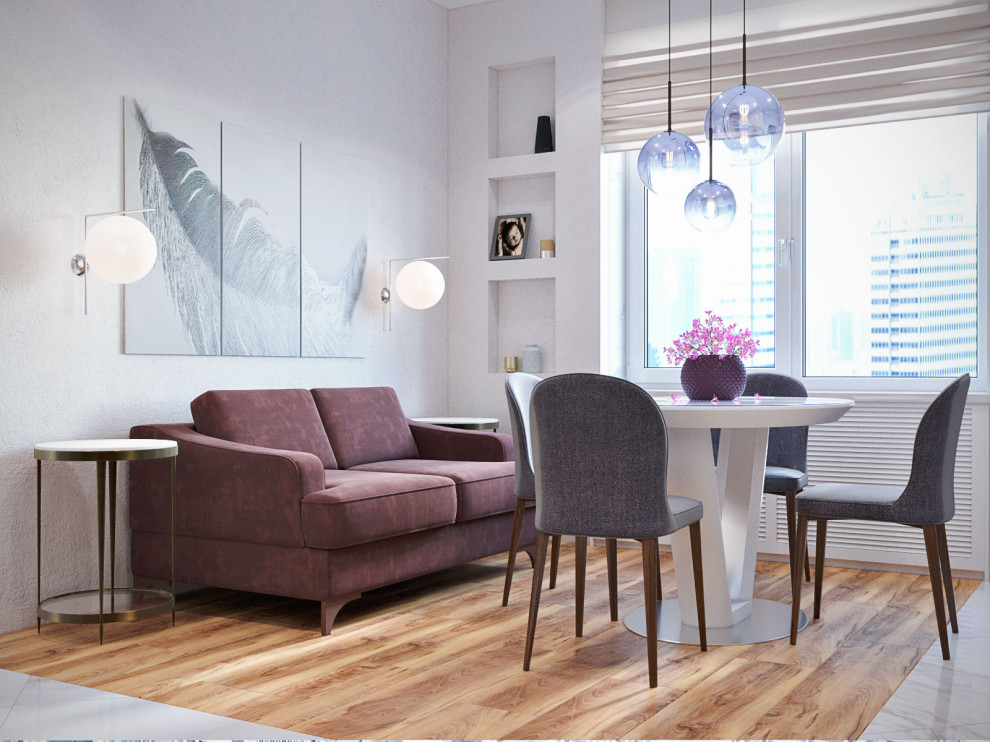 Единая зона кухни, столовой и гостиной.