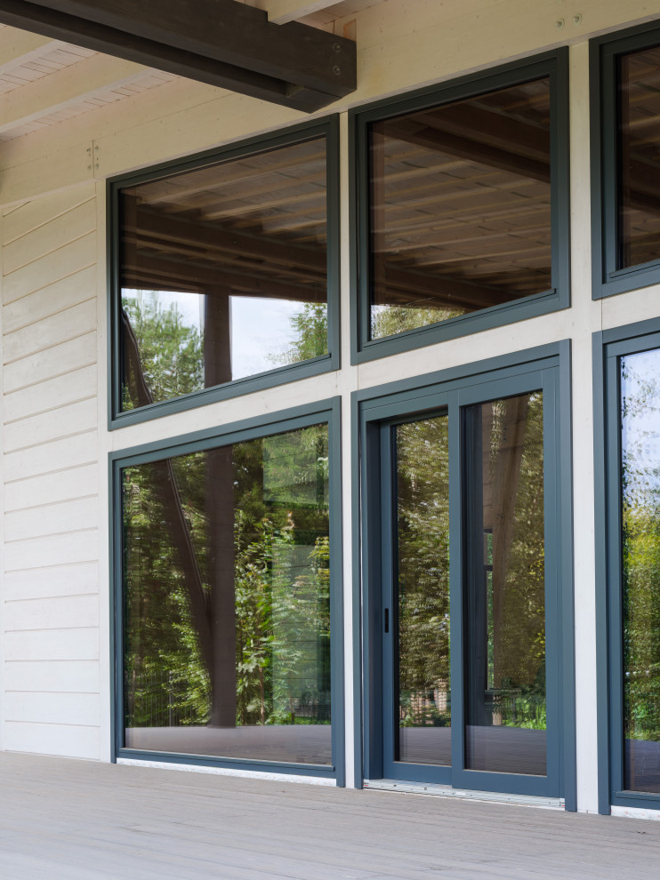 Трапецевидные окна, порталы и входные двери для современного дома