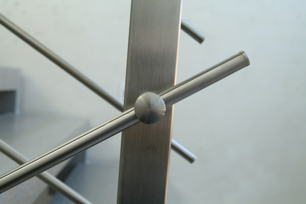 Modern metal stair covered by patina oak