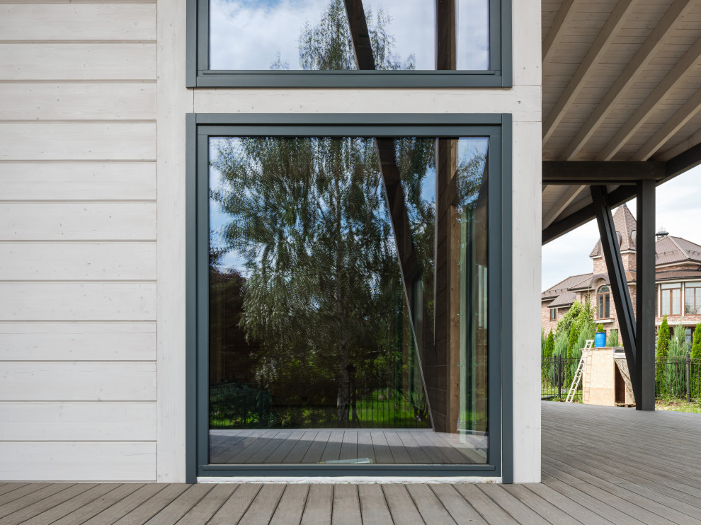 Трапецевидные окна, порталы и входные двери для современного дома