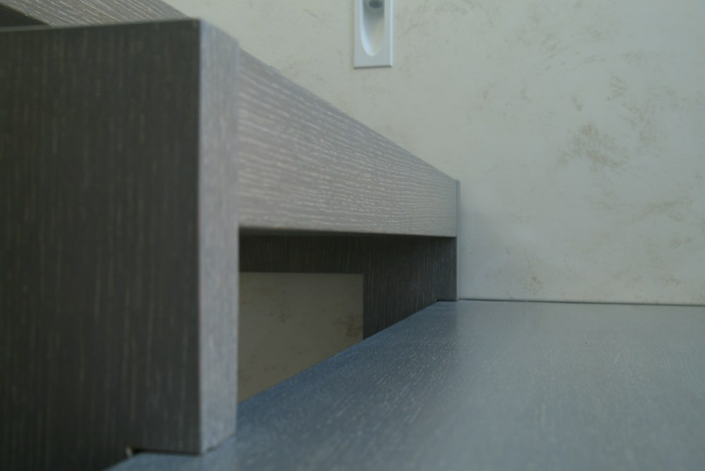 Modern metal stair covered by patina oak