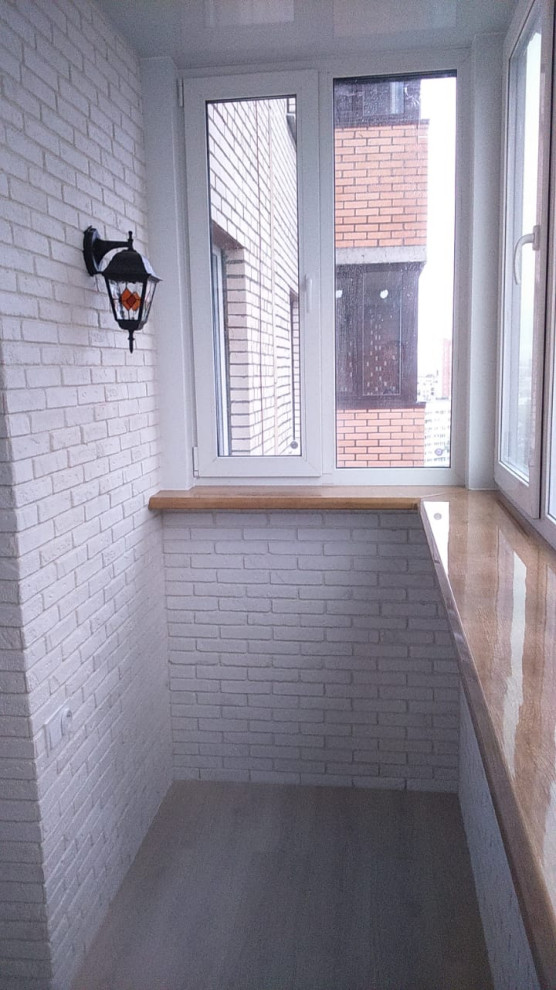 Замена остекления, утепление и отделка балкона декоративным камнем