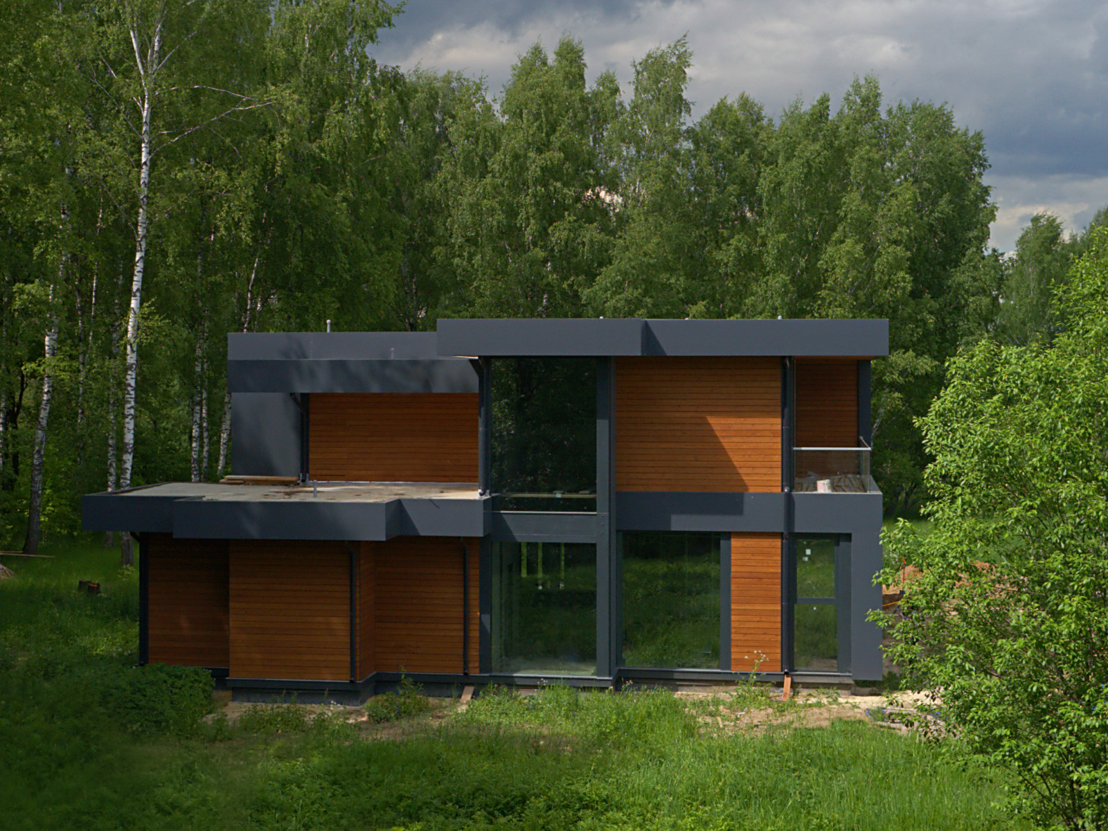 Двухэтажный дом с плоской кровлей и панорамным остеклением Flta'n'Wood 280м²