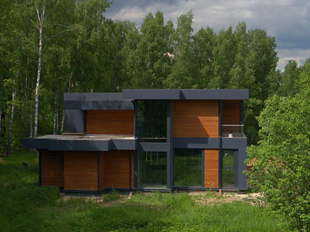 Двухэтажный дом с плоской кровлей и панорамным остеклением Flta'n'Wood 280м²