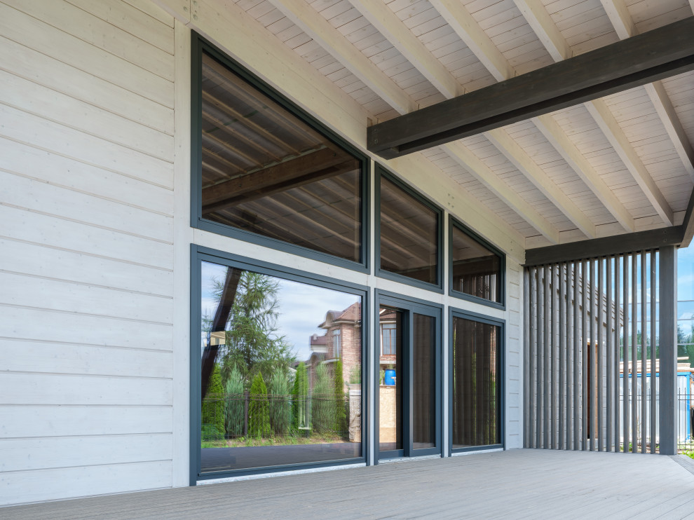 Трапецевидные окна, порталы и входные двери для современного дома