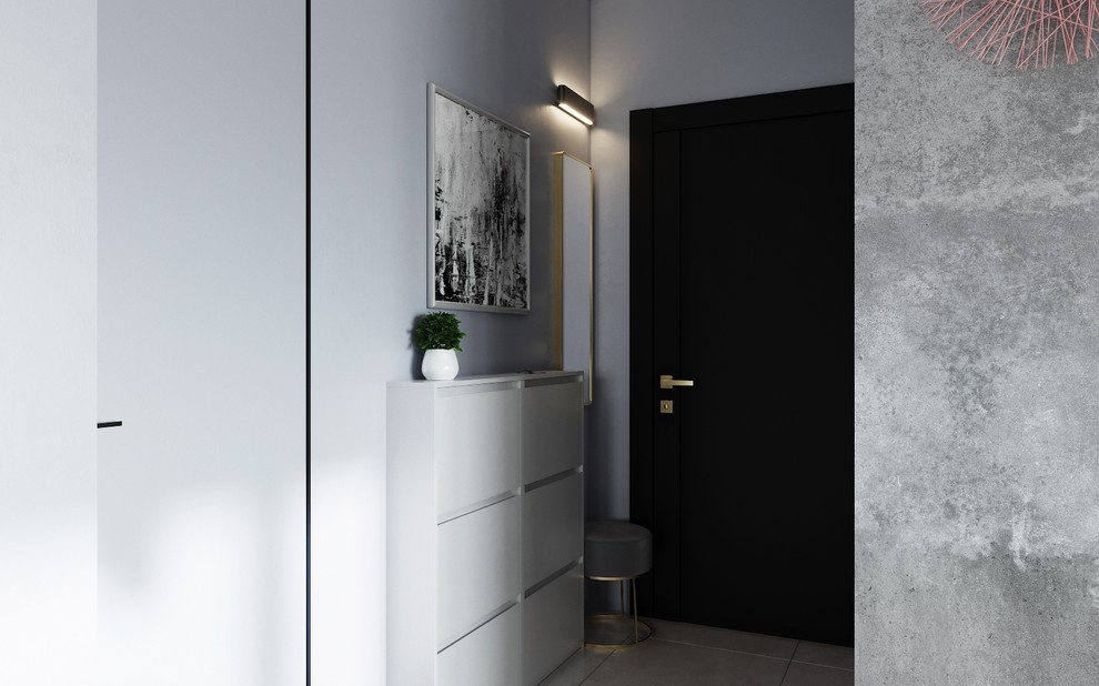 Зона прихожей с зеркалом, пуфиком и обувницей.