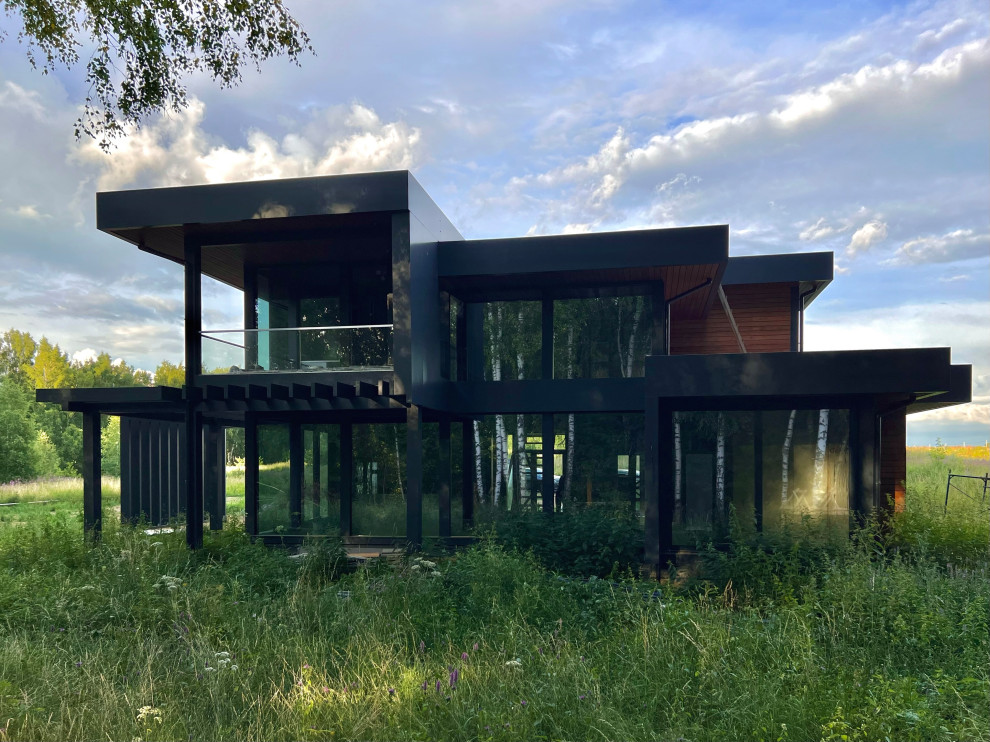 Двухэтажный дом с плоской кровлей и панорамным остеклением Flta'n'Wood 280м²