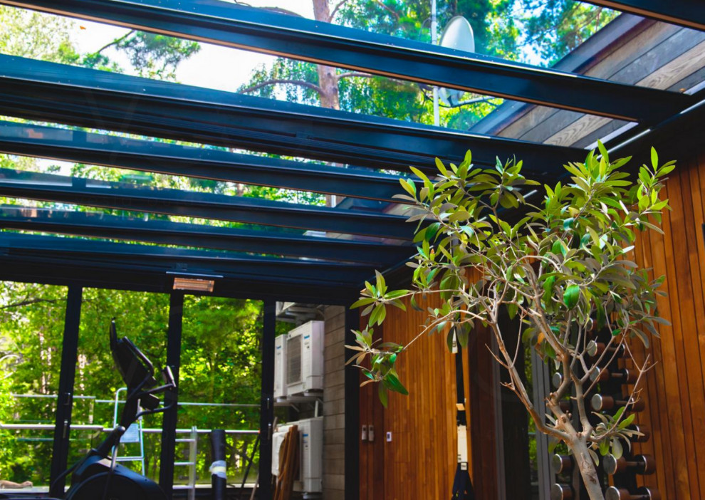 Стеклянная веранда на эксплуатируемой кровле