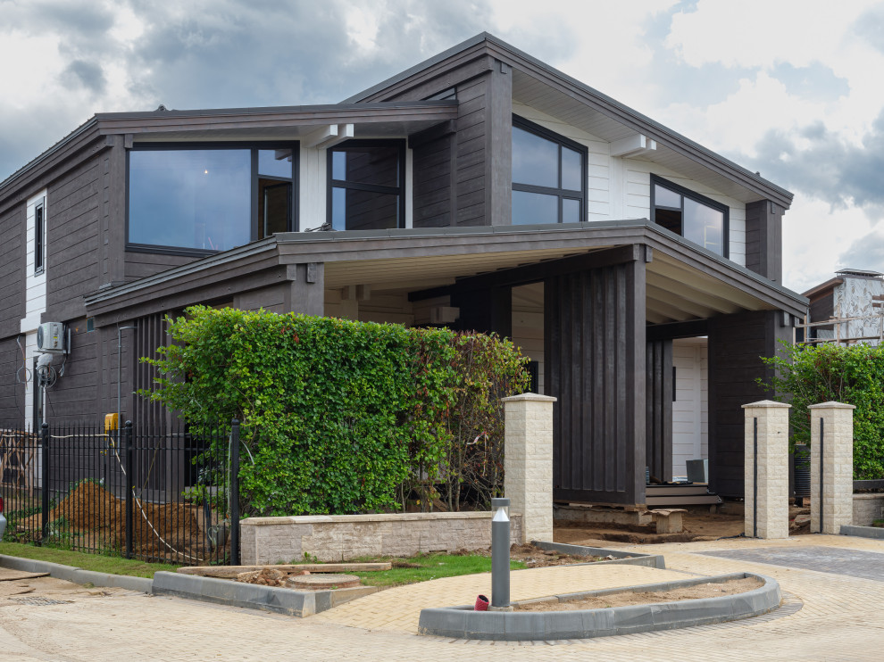 Трапецевидные окна, порталы и входные двери для современного дома