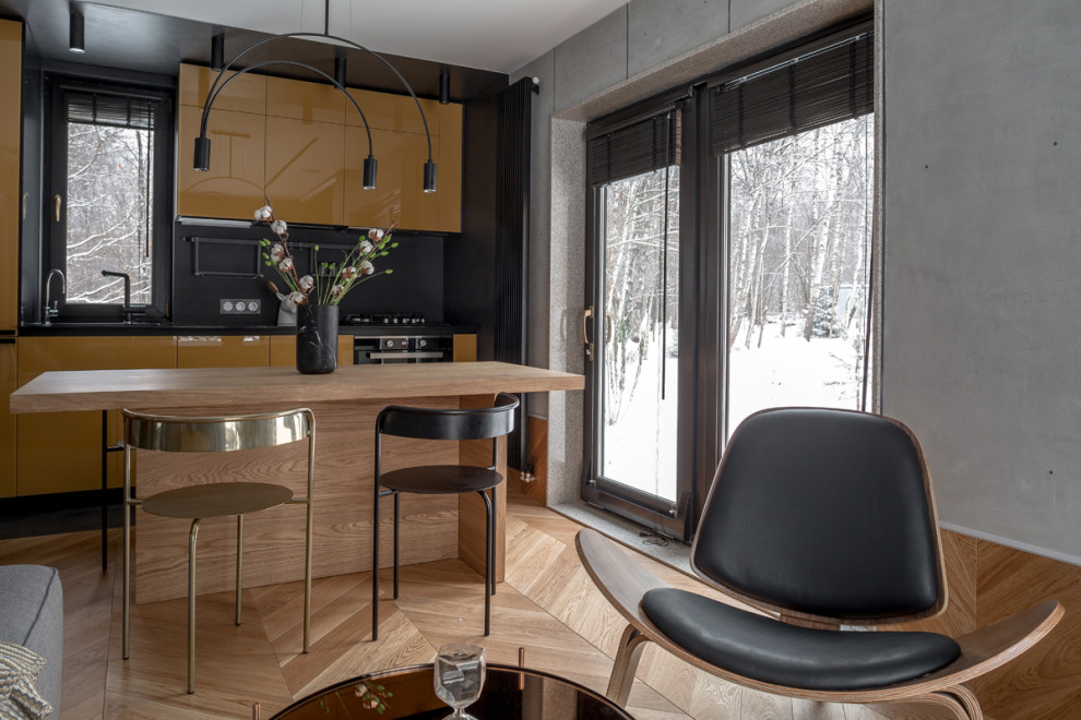 Глянцевая кухня с бетонной стеной