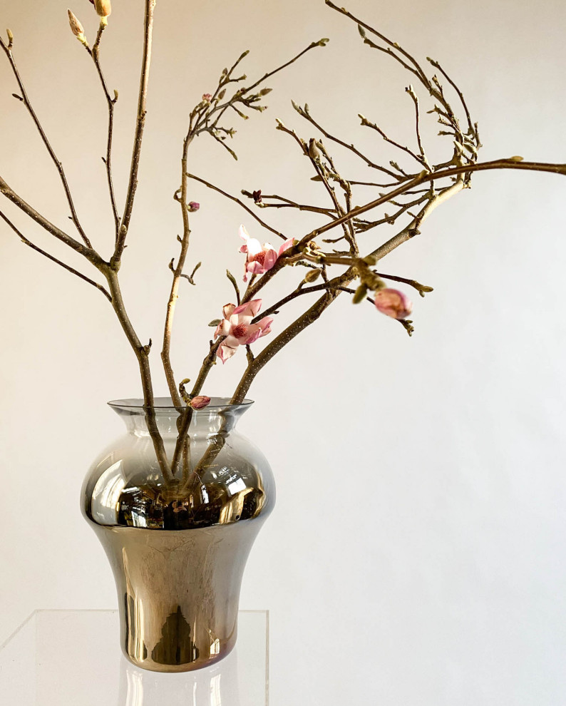 Flower arrangements in an&angel glass