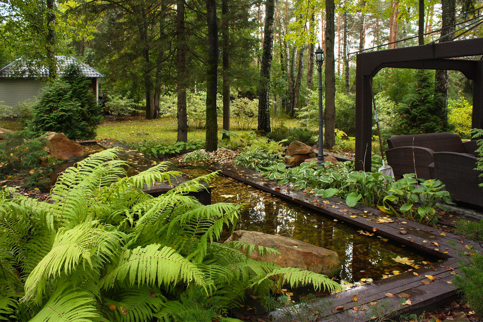 Ландшафтный проект лесного участка с искусственным водоемом в стиле Лофт.