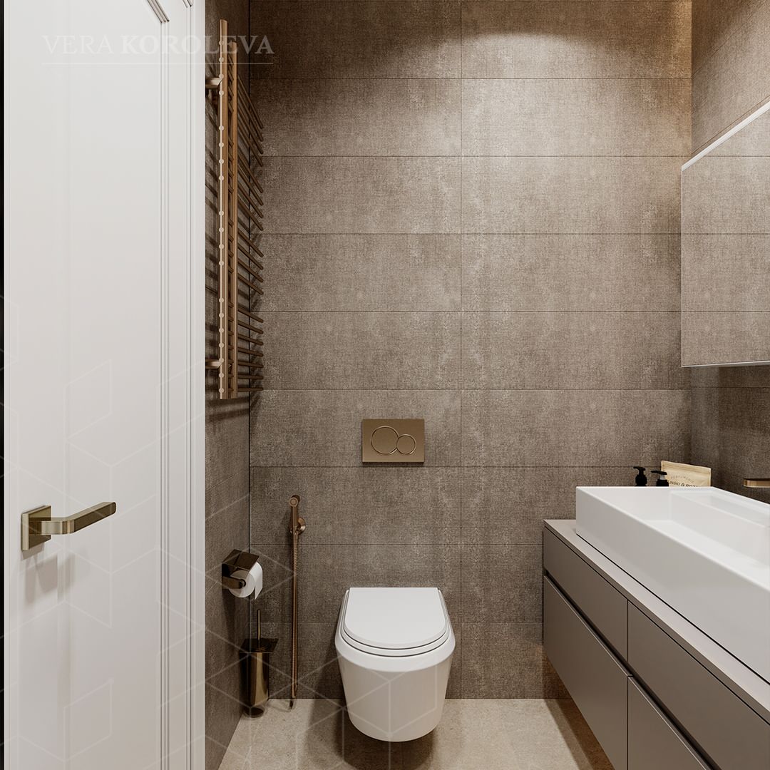 Сантехника бронзового цвета в сочетании с серо-коричневой плиткой